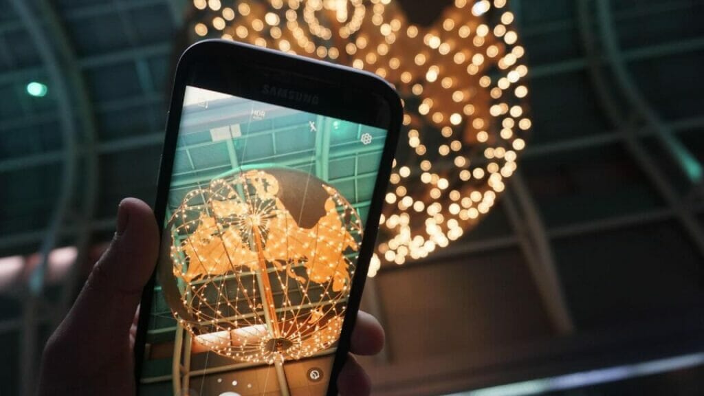 globe lights and a phone